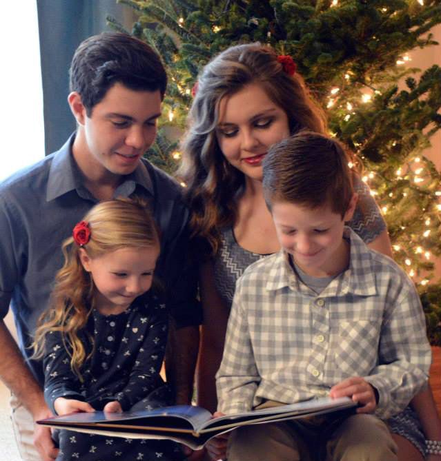 Family Photo Tips from the Pros: A Simple prop {book}, a symbolic background object {tree} and pops of red {lips and bows} for a subtle holiday twist